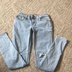 Distressed super skinny light wash jeans
